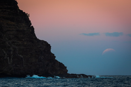 Partially eclipsed moonrise over Kawelikoa Point, Kauai