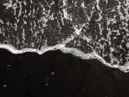 Waves on black sand